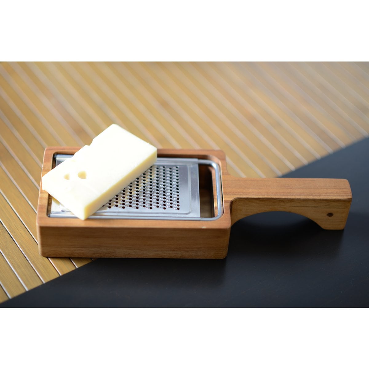 Cheese grater with acacia wood handle